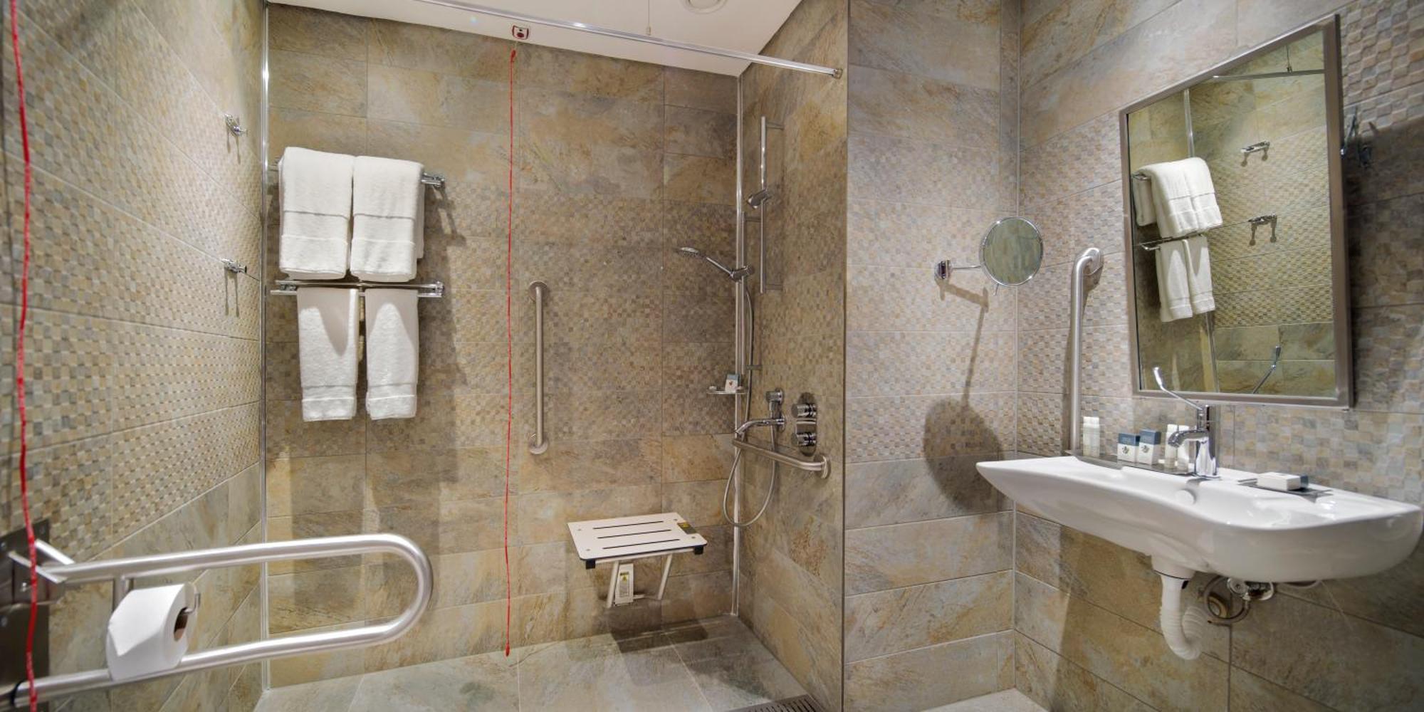 Doubletree By Hilton Istanbul - Piyalepasa Hotel Bagian luar foto A shower seat